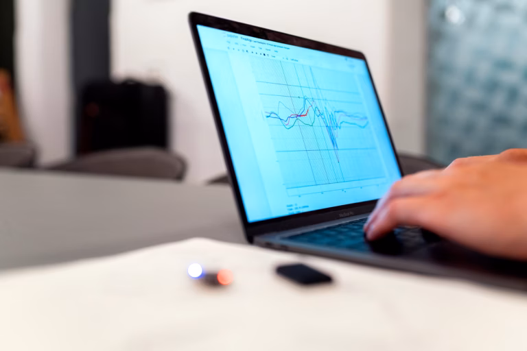 Senior engineer reviewing AI system outputs with quality assurance team