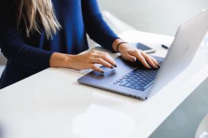 Administrative worker using AI tools at desk
