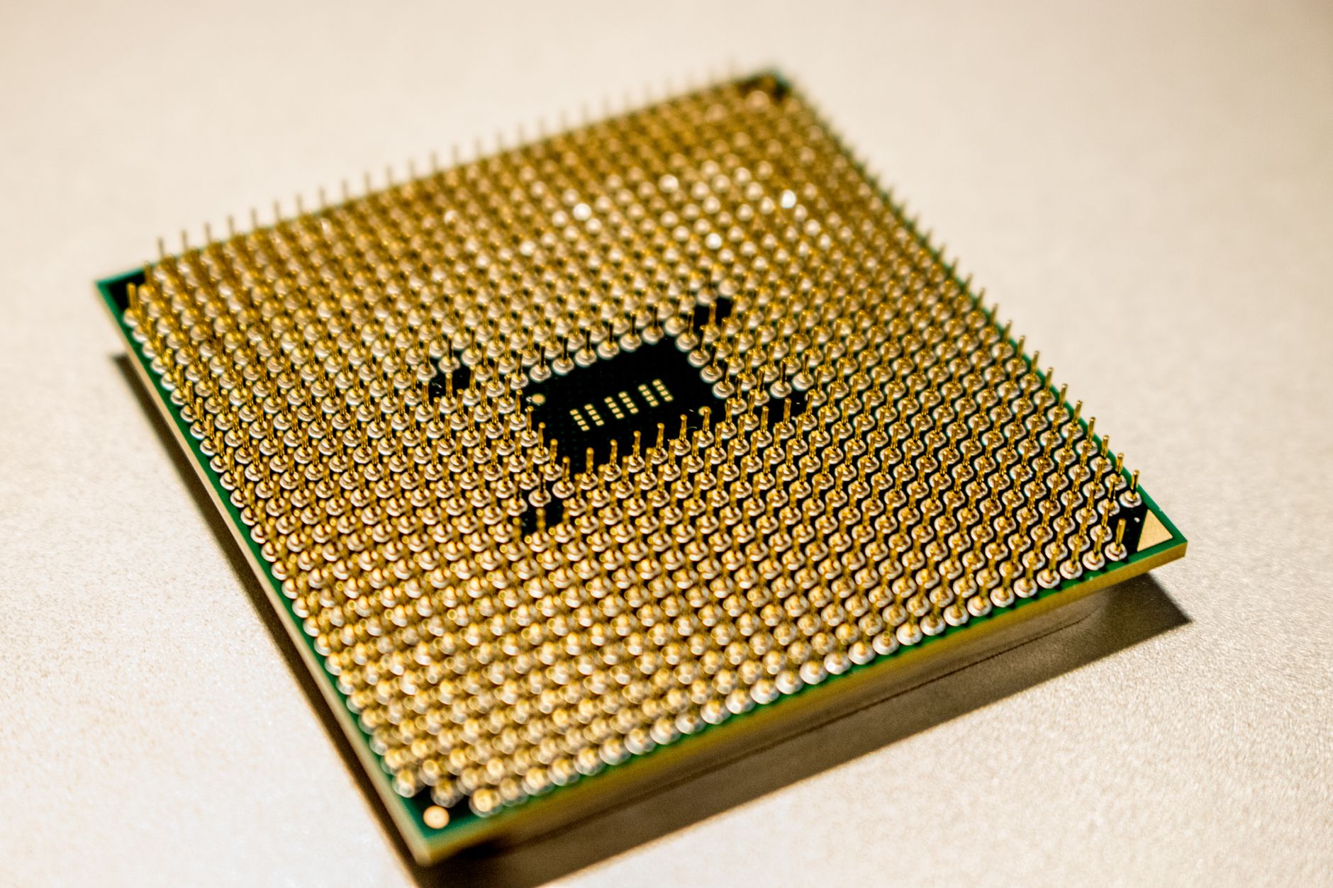 Detailed close-up of a golden microprocessor chip, ideal for technology concepts