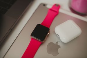 Apple Watch and AirPods arranged on display