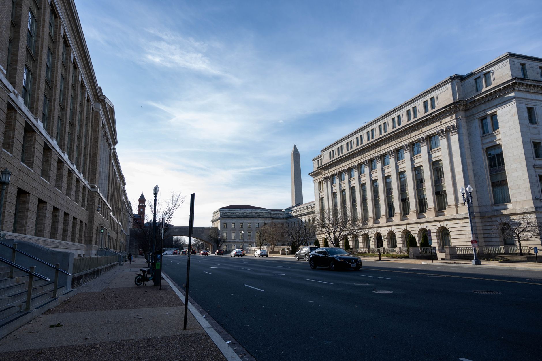 Street view in Washington DC featuring historic buildings and the Washington Monument