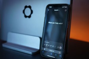 Close-up of a smartphone with AI chat interface, showcasing advanced technology in a sleek design