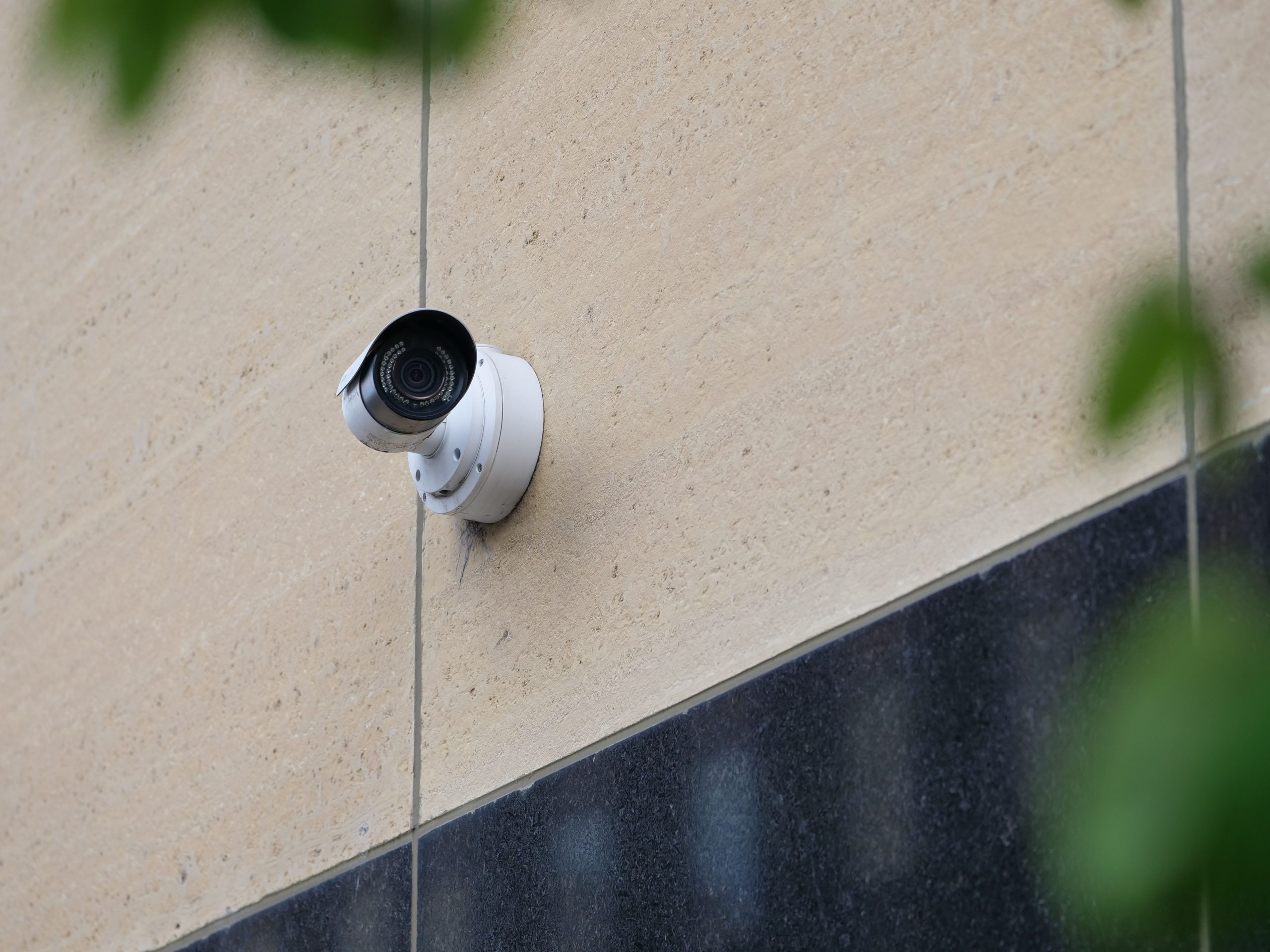 A wall-mounted surveillance camera; illustrative stock security photo