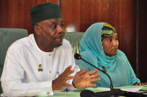 Nigerian officials meet around a conference table during a discussion about research and innovation funding
