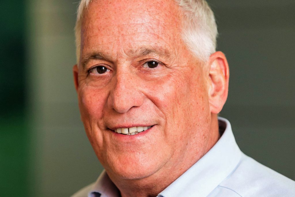 Walter Isaacson smiling in a close-up portrait